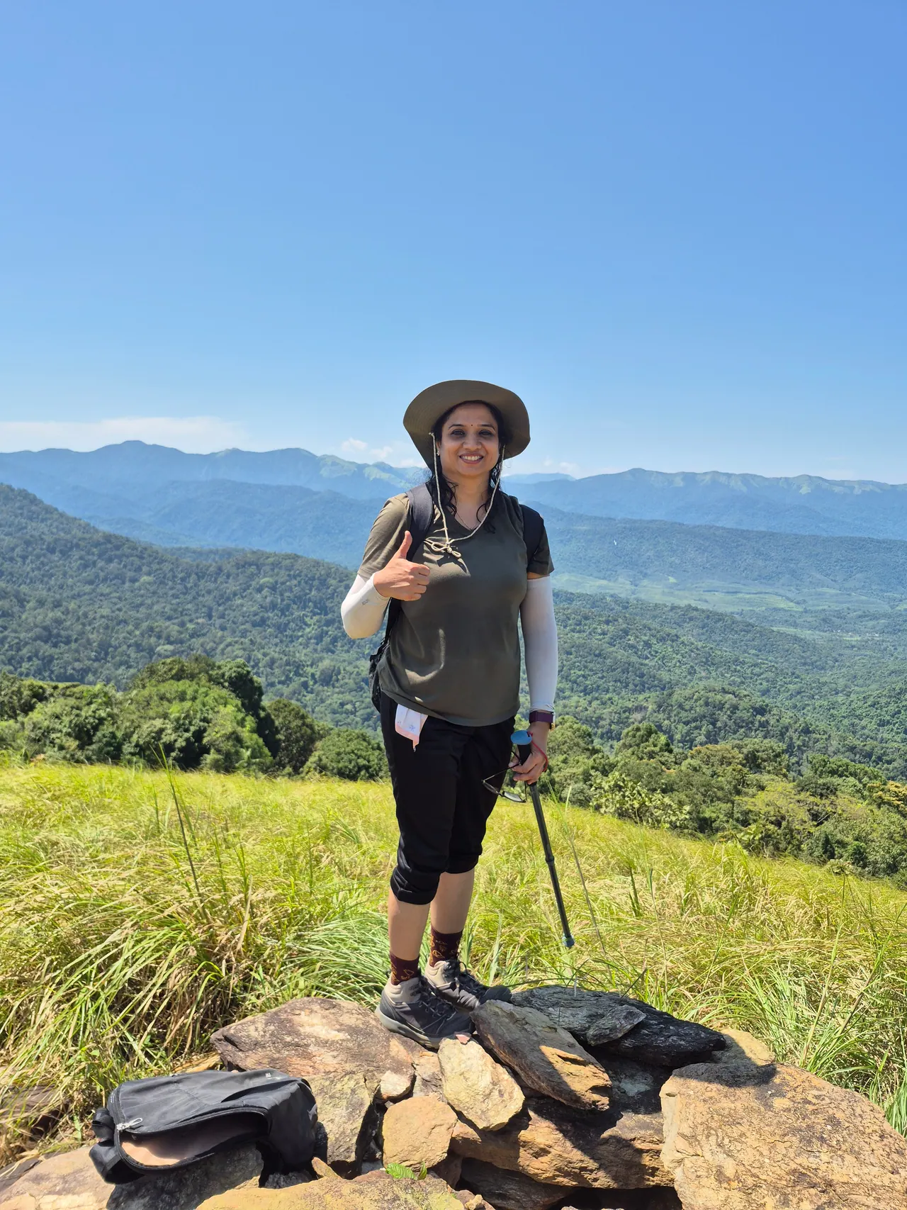 A trekker on the estate hilltop above the Malnad valley